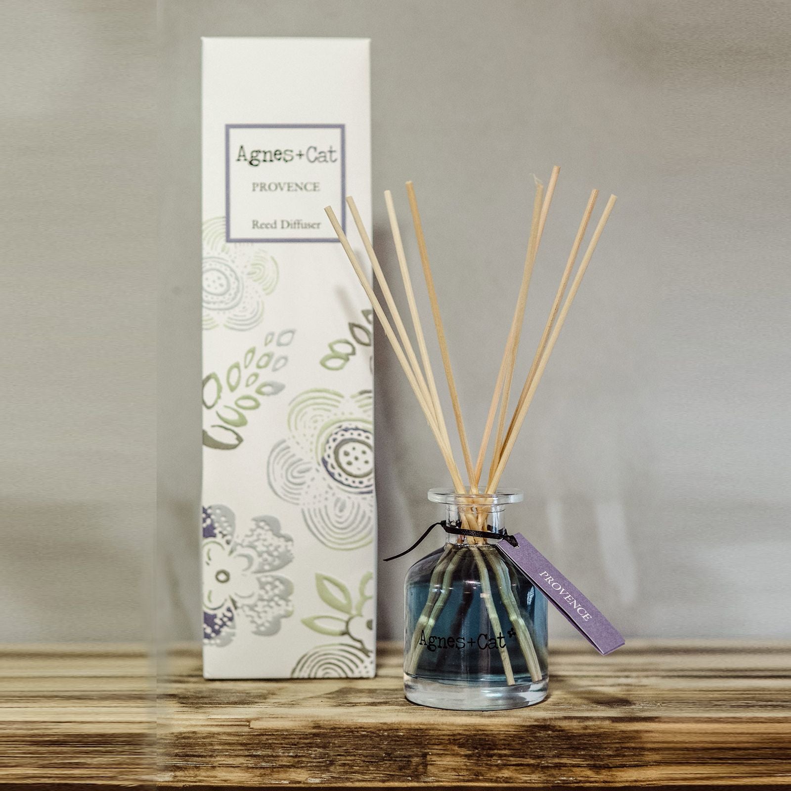 Elegant reed diffuser with flowers in a bright minimal interior